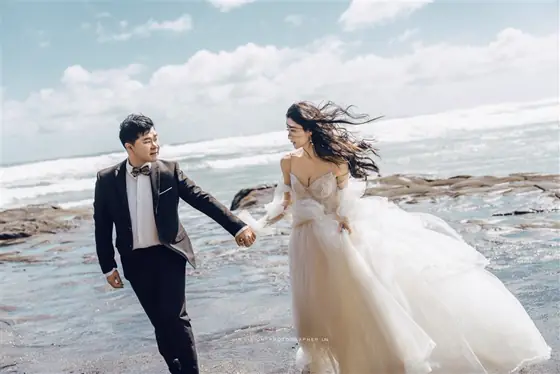 A couple walking by the sea